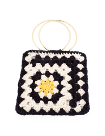Black and white square handmade crochet handbag with yellow center and gold circular metal handles.