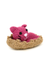 Slightly angled view of a crochet kitten in its rustic fiber basket.