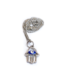Close up of silver Hamsa hand pendant with blue evil eye.