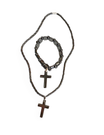 Flat lay of matching hematite cross jewelry set