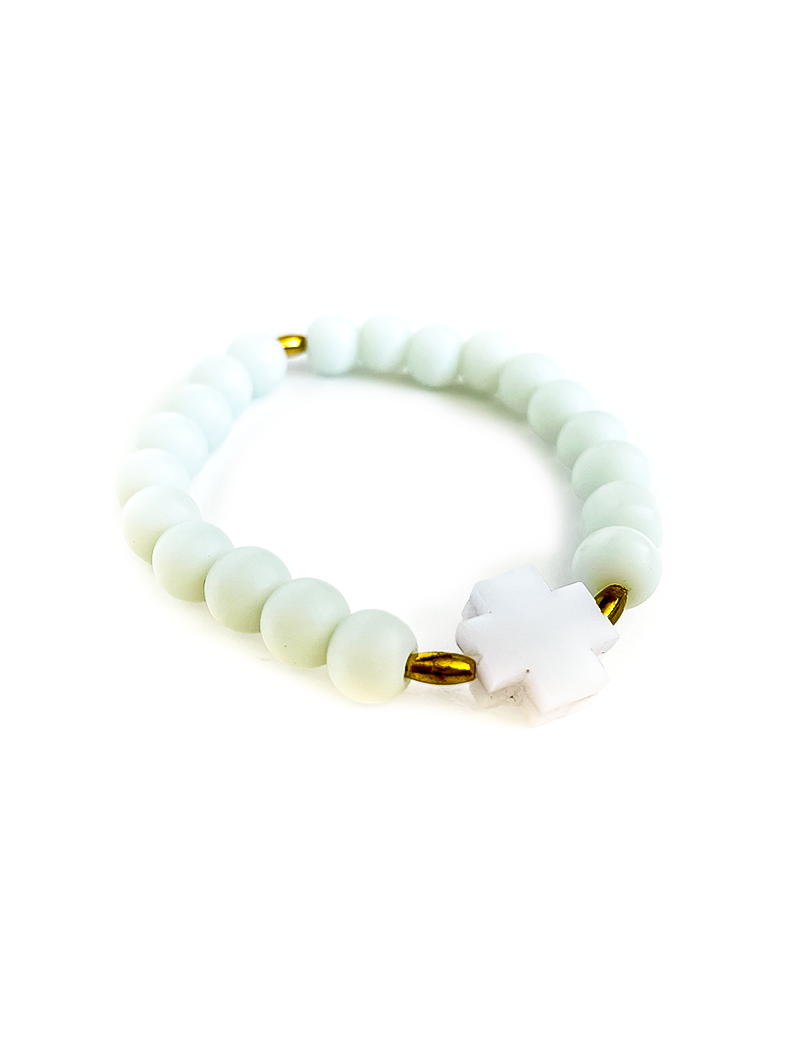 White matte onyx bead bracelet with a white plexiglass cross and gold spacers.