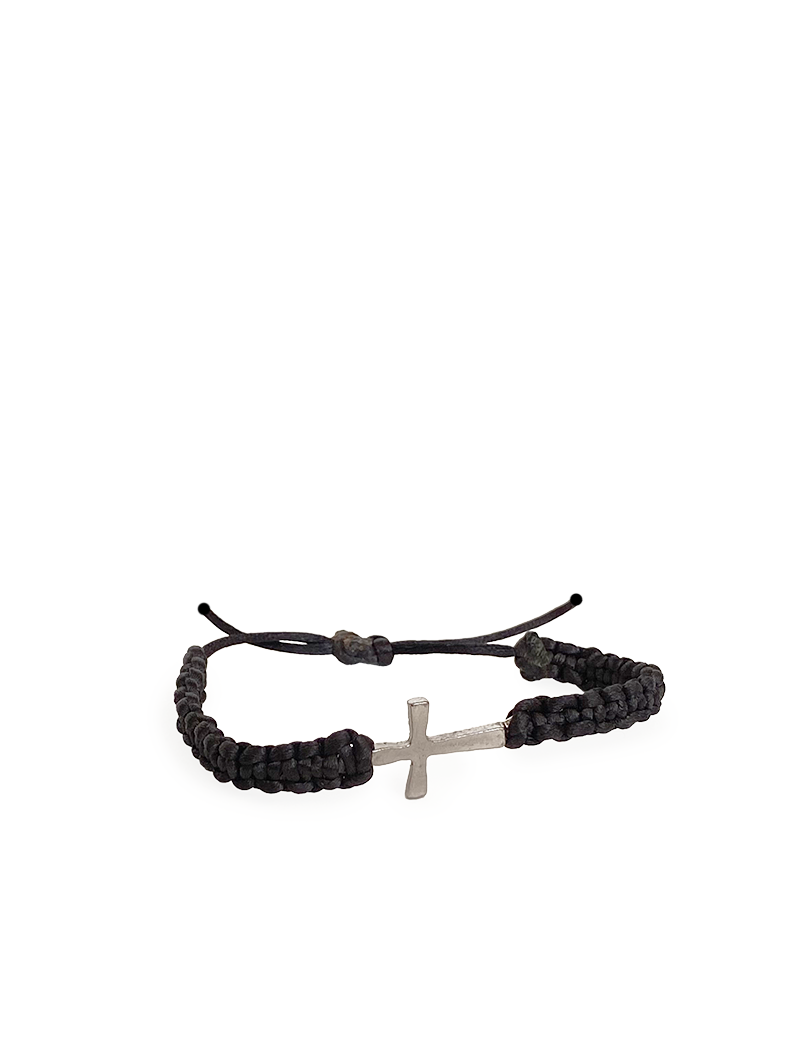 Minimalist silver metal cross on black woven bracelet.