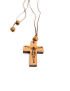 Close-up of laser-engraved Jesus on wooden cross pendant.