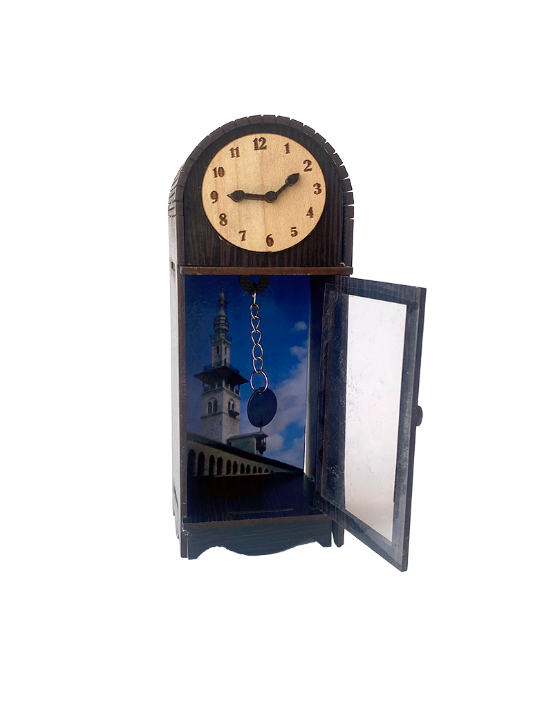 Miniature wooden clock with open door showing Umayyad Mosque interior.