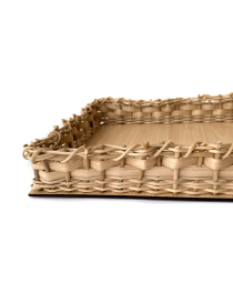 Detailed close-up of handwoven straw border and wooden base.