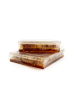 Two containers of Pure Syrian Mountain Honeycomb stacked on a white background.