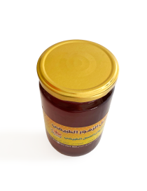 Gold metal lid on a jar of pure honey.