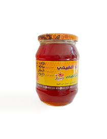 Jar of Syrian natural honey with black seeds.