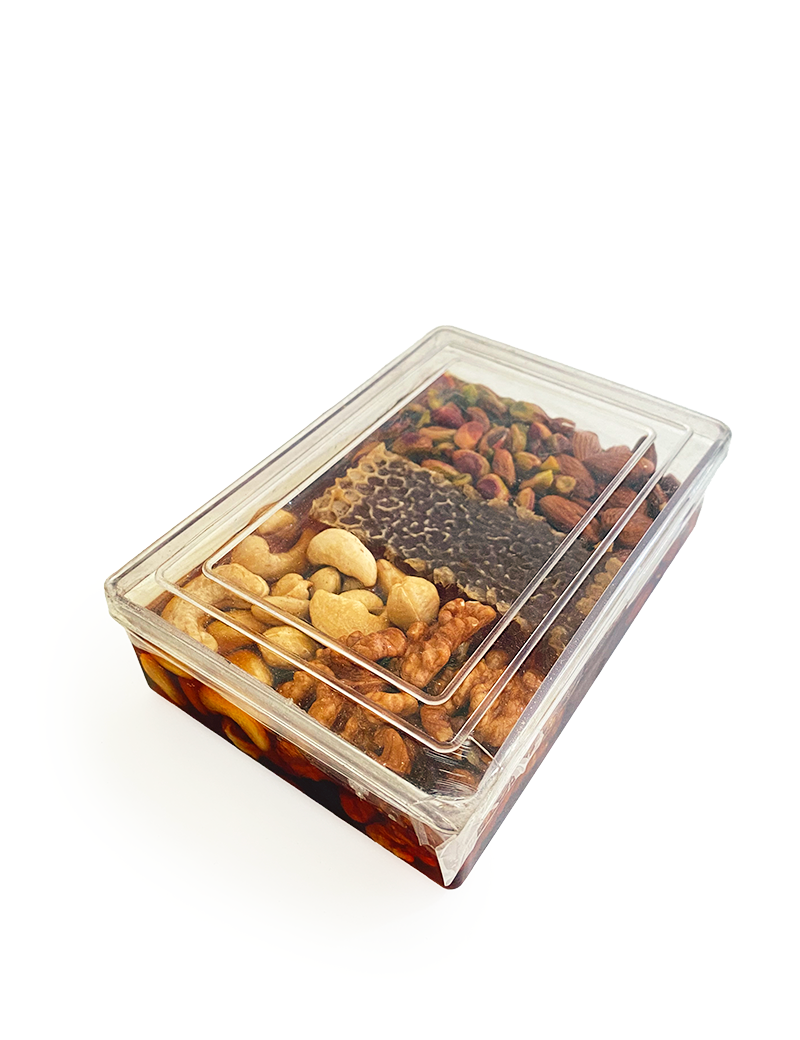 Luxury clear gift box filled with raw Syrian mountain honeycomb and mixed nuts.