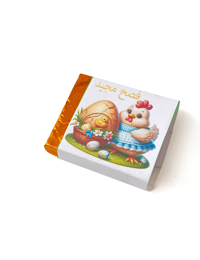 Handcrafted Easter chocolate square in gold foil with chick and egg illustration for delivery in Syria.