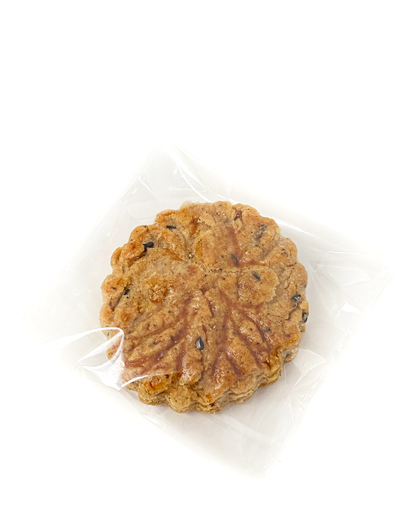Handcrafted Syrian Date Kleicha biscuit in clear individual packaging for freshness.