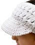 Close-up detail of the intricate woven cotton stitch on a white crochet visor.