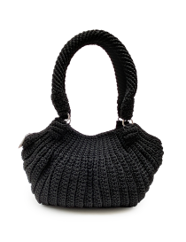 Front view of a handmade black crochet handbag with ribbed texture.