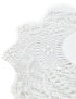 Detailed side view of the star-shaped lace edging on a white cotton coaster.