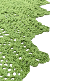 Overhead view of the cascading leaf design on the side of the crochet table runner.