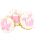 Assorted pink baby shower sugar cookies including stroller, bottle, and onesie.