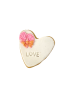 Heart-shaped sugar cookie with "LOVE" stamp and pink roses with gold bow.