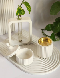 4-piece white concrete decor set with tray, bud vase, and ribbed jars.