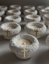 Handmade white concrete baptismal font candle with a gold cross.