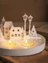 Glowing village concrete candle set with white wax.