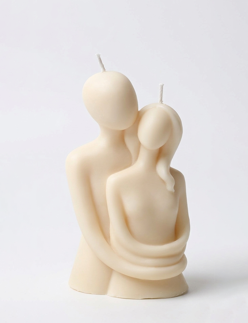 Artistic "The Embrace" candle with detailed couple silhouette for wedding gifts.