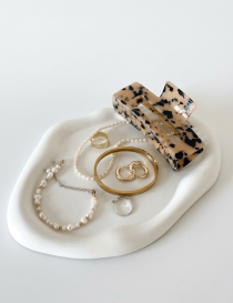 Concrete display stand used for showing jewelry and handmade crafts.