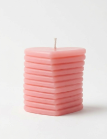 Peach-colored layered heart candle handcrafted by Tabark Designs in Syria.
