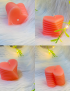 Peach-colored layered heart candle handcrafted by Tabark Designs in Syria.