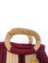 Close-up detail of the woven natural bamboo handle and neat macrame thread knots.