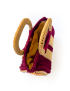 Top interior view of the macrame bag showing the yellow fabric lining and open storage space.