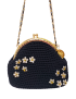 Close-up of hand-crocheted black purse adorned with 3D jasmine flower embroidery