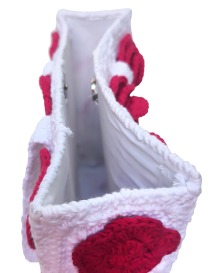 Hand-crocheted white bag interior with magnetic snap closure and fabric lining