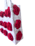 Side view of handmade white crochet shoulder bag with 3D red roses