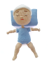 Handcrafted Seba Crochet Nano doll lying down with sleeping face and blue pillow