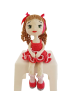 Handmade crochet doll Maha sitting on a stool in a pink dress - gift to Syria