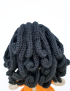 Detailed back view of dark curly hair on handmade crochet doll Lora