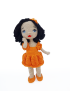 Cute pose of Lora handmade amigurumi crochet doll with orange outfit