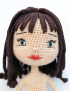 Detailed facial features and hand-stitched hair of Tala crochet doll