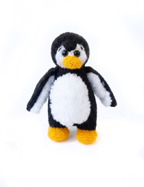 Handmade crochet penguin baby toy in black, white, and yellow by Seba Crochet