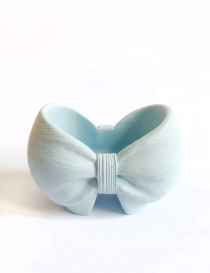 Front top view of handcrafted gypsum bow vase by Night Candles on clean white background with subtle shadow