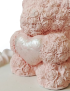 Close-up showing intricate texture of the pink rose bear gift.