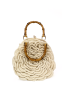 Detailed view of bamboo handles and pearl clasp on cream crochet bag