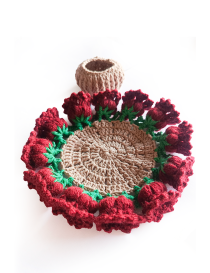 Open floral crochet coaster with red roses border and holder basket.