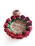Open floral crochet coaster with red roses border and holder basket.