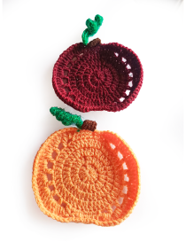 Handmade crochet pumpkin coasters crafted from cotton blend yarn