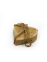 Angled close-up view of heart-shaped natural Syrian olive oil soap with herbal flecks