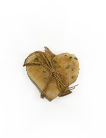 Overhead top view of Ogaria natural heart-shaped olive oil soap tied with jute string