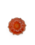 Direct top-down flat lay view of translucent donut-shaped turmeric glycerin soap