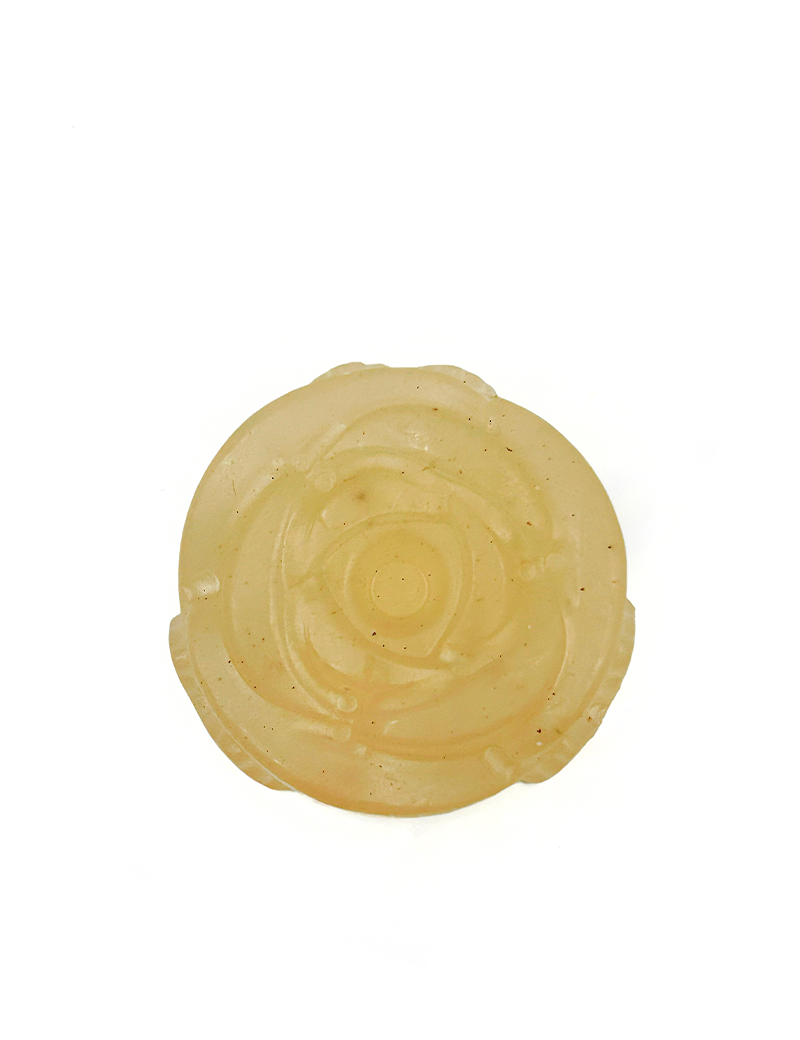Top view of translucent amber rose-shaped glycerin soap with collagen and frankincense by Ogaria