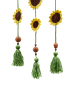 Detail of hanging mini sunflowers with wooden beads and green yarn tassels.